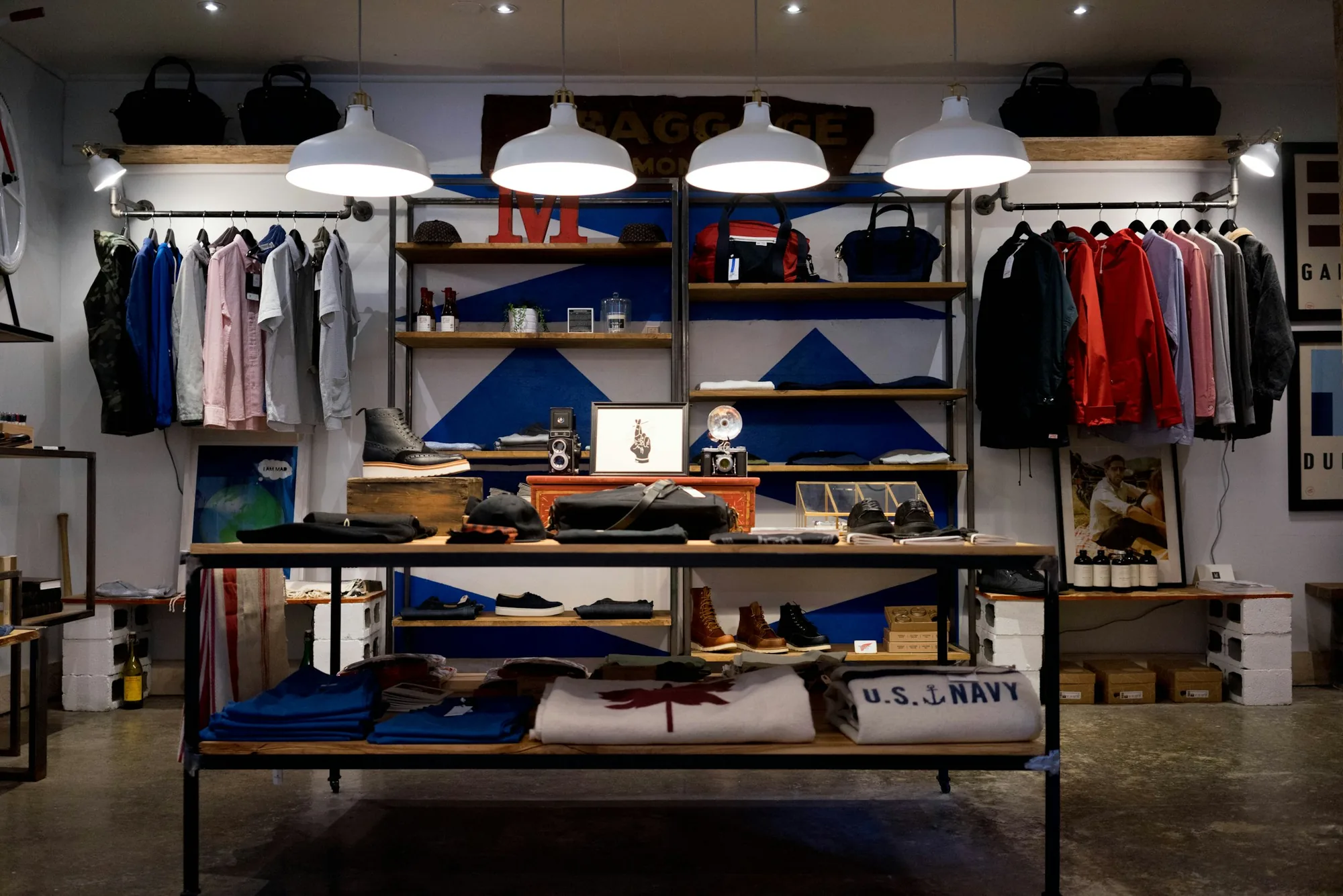 Clothing boutique interior with shelves and garment rails