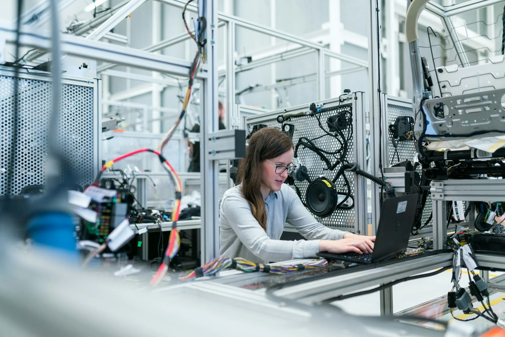 Engineer working at an automated production test rig